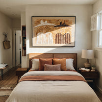 Black Hat Meets Ivory - earth tone figure pair painting by Elliot Vale, modern figurative horizontal wall art - styled room scene view 3