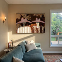 Pink Hats Meet Bark - pink hat figure pair painting by Elliot Vale, modern figurative horizontal wall art - styled room scene view 2