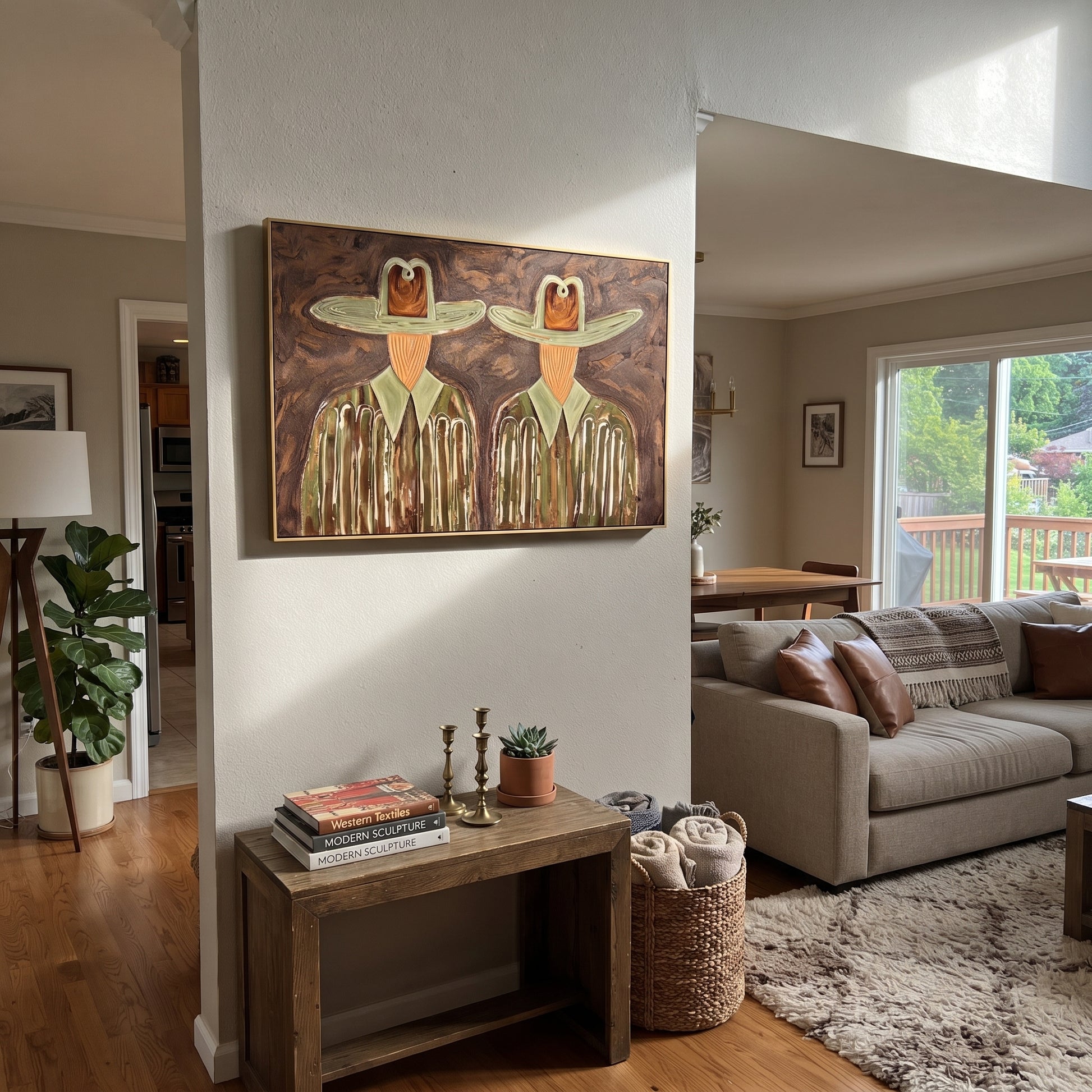 Green Hats Watch Together - owl hat figure pair painting by Elliot Vale, modern figurative horizontal wall art - styled room scene view 2