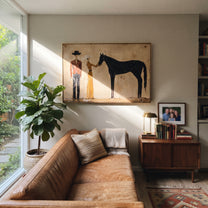 Gentle Hand Meets Horse - horse handler couple painting by Elliot Vale, modern figurative horizontal wall art - styled room scene view 3