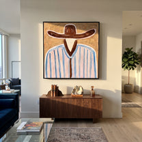 Brown Brim Meets Sky - blue striped hat figure painting by Elliot Vale, modern figurative square wall art - styled room scene view 3