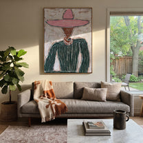 Pink Brim Guards Green - pink sombrero figure painting by Elliot Vale, modern figurative vertical wall art - styled room scene view 2