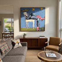 Pink Boots Chase Starlight - reclining cowgirl painting by Elliot Vale, modern figurative square wall art - styled room scene view 4
