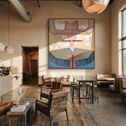 Blush Wings Cross Sky - blue western shirt painting by Elliot Vale, modern figurative square wall art - styled room scene view 1