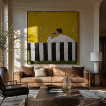 Yellow Silence Holds Glass - seated drinking man painting by Elliot Vale, modern figurative square wall art - styled room scene view 2