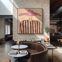 Rose Wings Float Softly - brown striped hat figure painting by Elliot Vale, modern figurative square wall art - styled room scene view 1