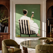 White Dress Raises Wine - seated wine woman painting by Elliot Vale, modern figurative vertical wall art - styled room scene view 5