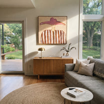 Pink Horizon Holds Brown - brown striped hat figure painting by Elliot Vale, modern figurative square wall art - styled room scene view 5