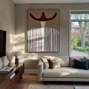 Rust Horns Meet Lines - blue striped hat figure painting by Elliot Vale, modern figurative vertical wall art - styled room scene view 1