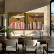 Sombreros Lean Across Earth - earth toned sombrero pair by Elliot Vale, modern figurative set of 2 wall art - styled room scene view 1