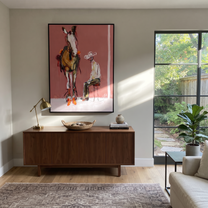 Quiet Chair Meets Horse - seated cowboy and horse painting by Ethan Mercer, contemporary Western vertical wall art – styled room scene view 2