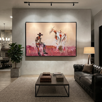 Pink Dust Holds Distance - cowboy and paint horse painting by Ethan Mercer, contemporary Western horizontal wall art – styled room scene view 5