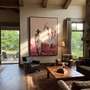Blush Ground Holds Waiting - cowboy and paint horse painting by Ethan Mercer, contemporary Western vertical wall art – styled room scene view 1
