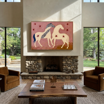 Two Cream Horses Gather - two horses folk painting by Ethan Mercer, contemporary Western horizontal wall art – styled room scene view 2