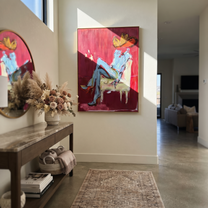 Blue Boots Rest Quietly - seated cowboy portrait painting by Ethan Mercer, contemporary Western vertical wall art – styled room scene view 5