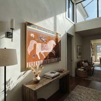 Pale Horse Runs Sunward - white horse folk painting by Ethan Mercer, contemporary Western horizontal wall art – styled room scene view 5
