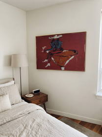 Burgundy Glass Holds Midnight - seated cowgirl martini portrait by Ethan Mercer, contemporary Western horizontal wall art – styled room scene view 7