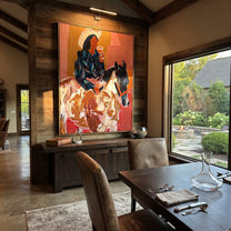 Blue Rider Meets Herd - cowboy horse and cattle painting by Ethan Mercer, contemporary Western vertical wall art – styled room scene view 1