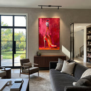 Red Heel Holds Rider - cowboy on high heel painting by Ethan Mercer, contemporary Western vertical wall art – styled room scene view 1