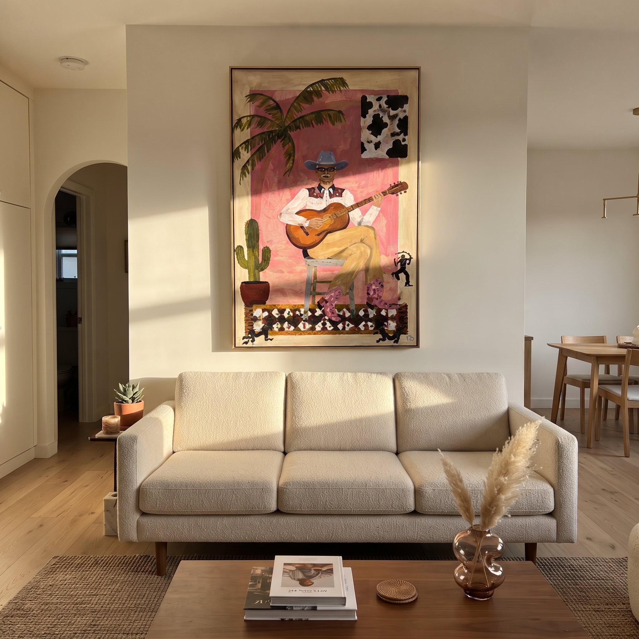 Guitar Warms Pink Courtyard - cowboy guitar portrait painting by Ethan Mercer, contemporary Western vertical wall art – styled room scene view 4