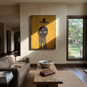 Black Hat Counts Time - standing cowboy portrait painting by Ethan Mercer, contemporary Western vertical wall art – styled room scene view 1