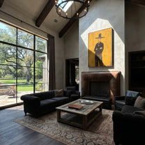 Black Hat Counts Time - standing cowboy portrait painting by Ethan Mercer, contemporary Western vertical wall art – styled room scene view 5