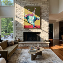 Teal Horns Carry Supper - reclining cowgirl bull painting by Ethan Mercer, contemporary Western vertical wall art – styled room scene view 4