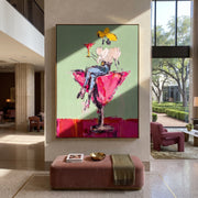 Magenta Glass Holds White - cowgirl in cocktail glass painting by Ethan Mercer, contemporary Western vertical wall art – styled room scene view 1
