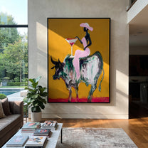 Golden Ground Raises Toast - black rider bull painting by Ethan Mercer, contemporary Western vertical wall art – styled room scene view 2