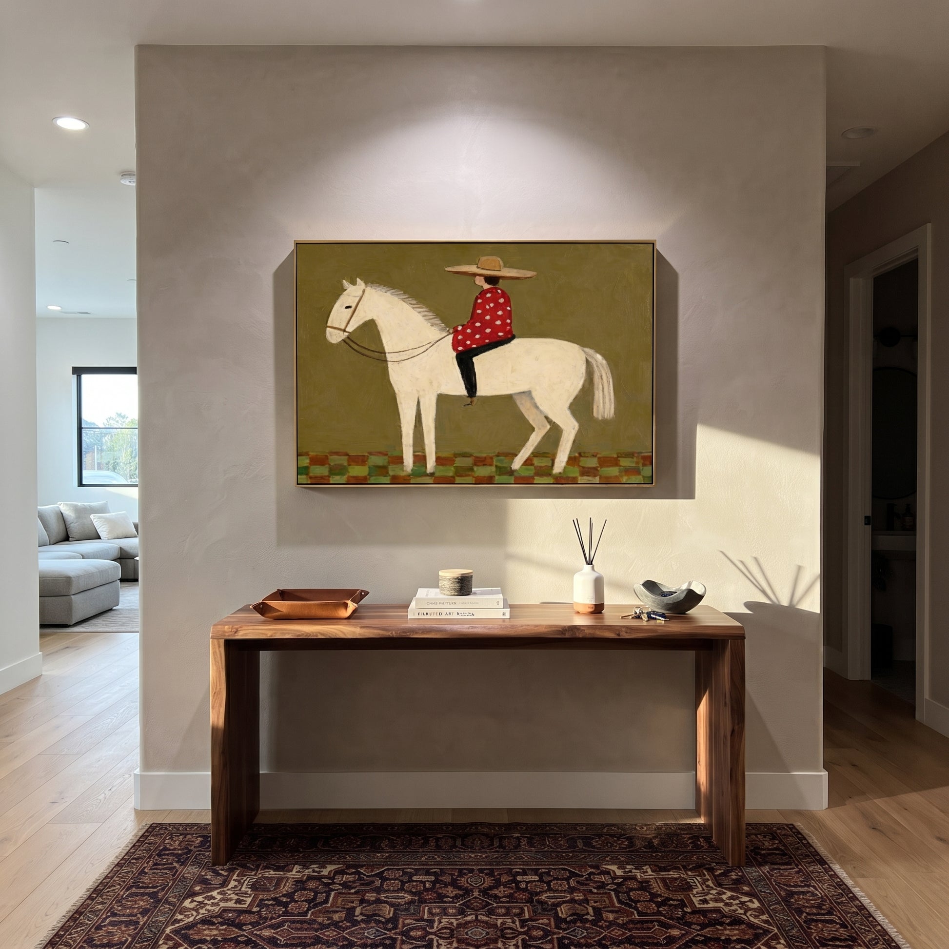 Red Dots Ride Ivory - folk rider horse painting by Ethan Mercer, contemporary Western horizontal wall art – styled room scene view 2