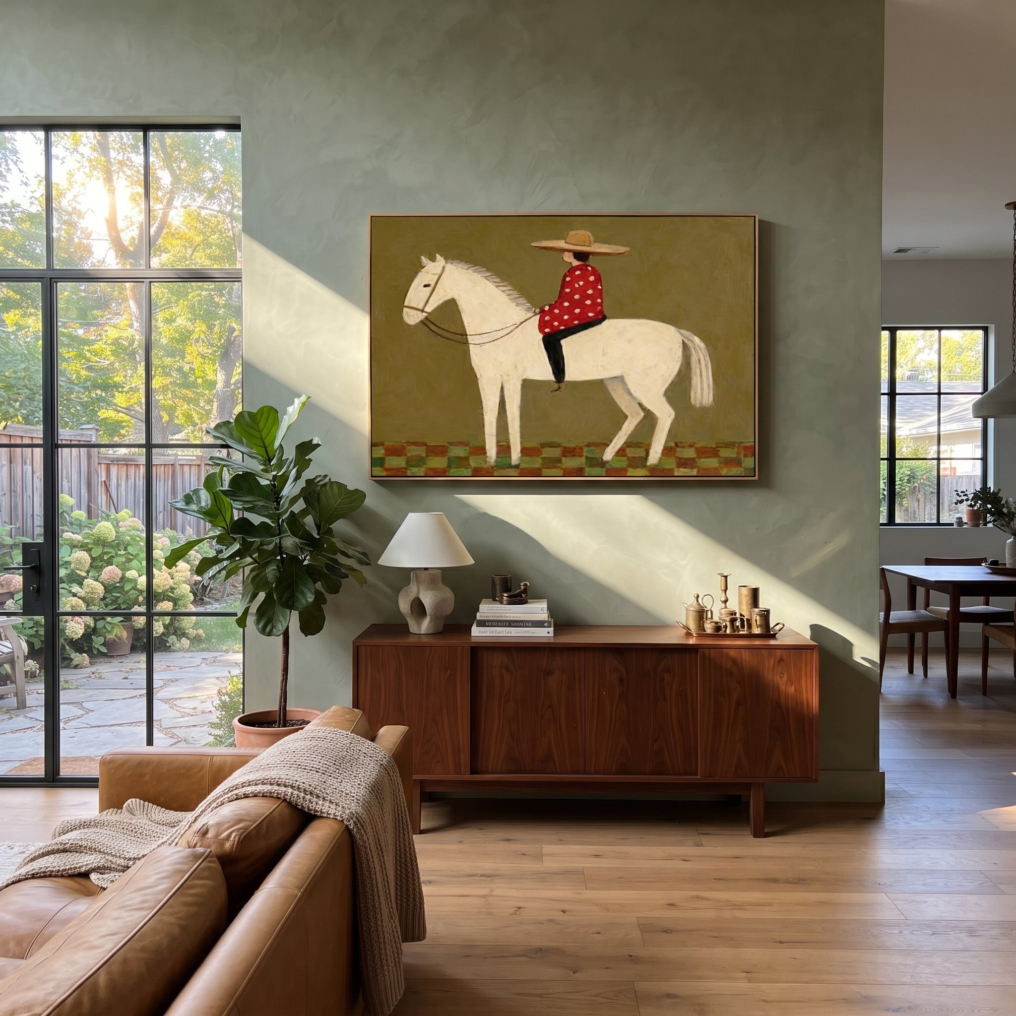 Red Dots Ride Ivory - folk rider horse painting by Ethan Mercer, contemporary Western horizontal wall art – styled room scene view 3