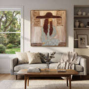 Braided Silence Waits Indoors - cowgirl under hat portrait by Ethan Mercer, contemporary Western square wall art – styled room scene view 1