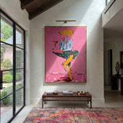 Crossed Legs Hold Evening - seated cowboy drink painting by Ethan Mercer, contemporary Western vertical wall art – styled room scene view 1