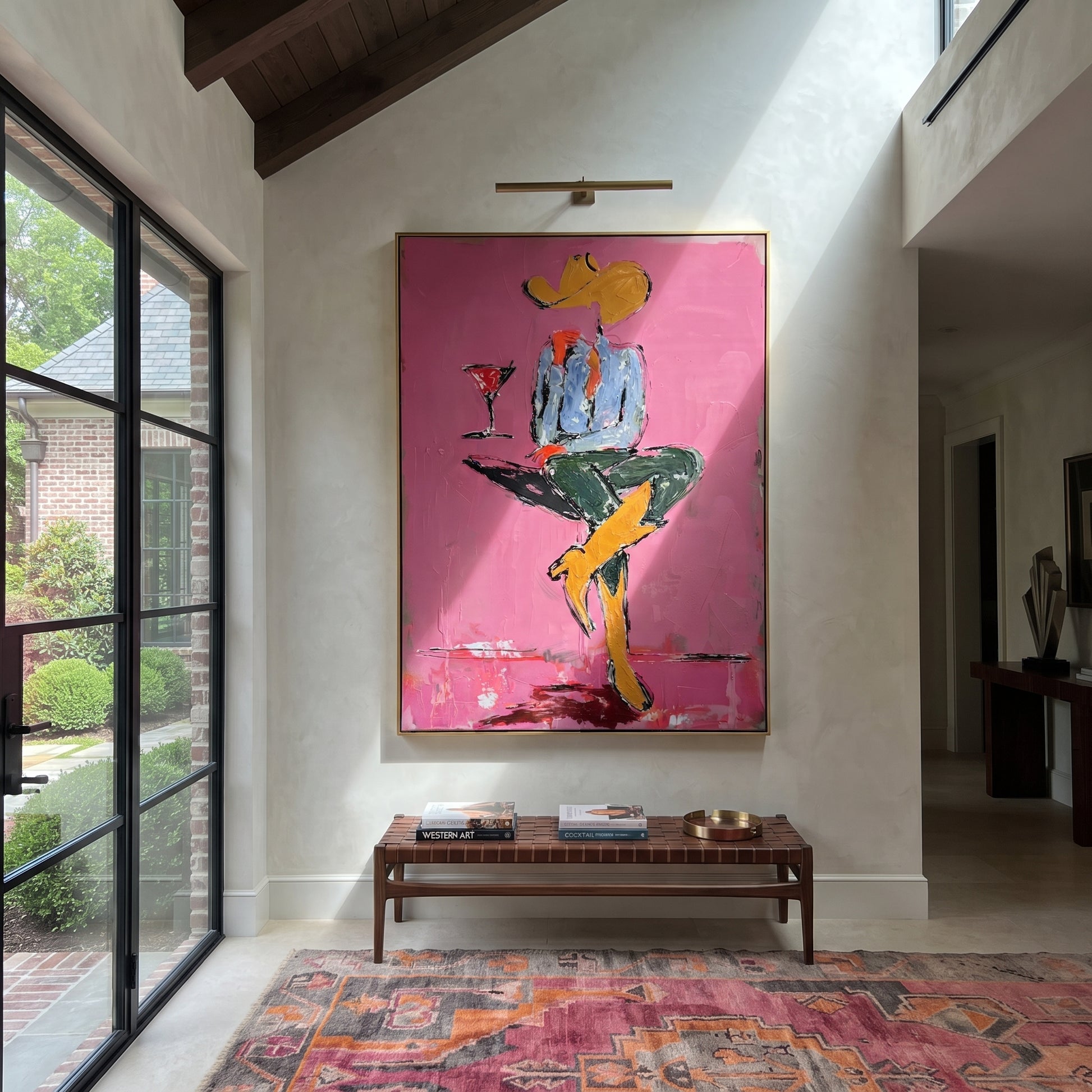 Crossed Legs Hold Evening - seated cowboy drink painting by Ethan Mercer, contemporary Western vertical wall art – styled room scene view 1