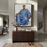 Blue Robe Holds Calm - seated man robe painting by Ethan Mercer, contemporary Western vertical wall art – styled room scene view 1