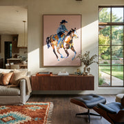 Blue Rider Floats Pale - cowboy pink horse painting by Ethan Mercer, contemporary Western vertical wall art – styled room scene view 1
