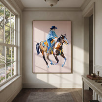Blue Rider Floats Pale - cowboy pink horse painting by Ethan Mercer, contemporary Western vertical wall art – styled room scene view 5