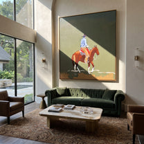 Chestnut Steps Cross Olive - rider landscape horse painting by Ethan Mercer, contemporary Western square wall art – styled room scene view 1