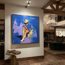 Blue Ground Holds Friendship - cowboy and dog painting by Ethan Mercer, contemporary Western square wall art – styled room scene view 5