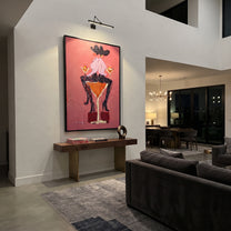 Two Hats Share Glass - two cowgirls martini painting by Ethan Mercer, contemporary Western vertical wall art – styled room scene view 4