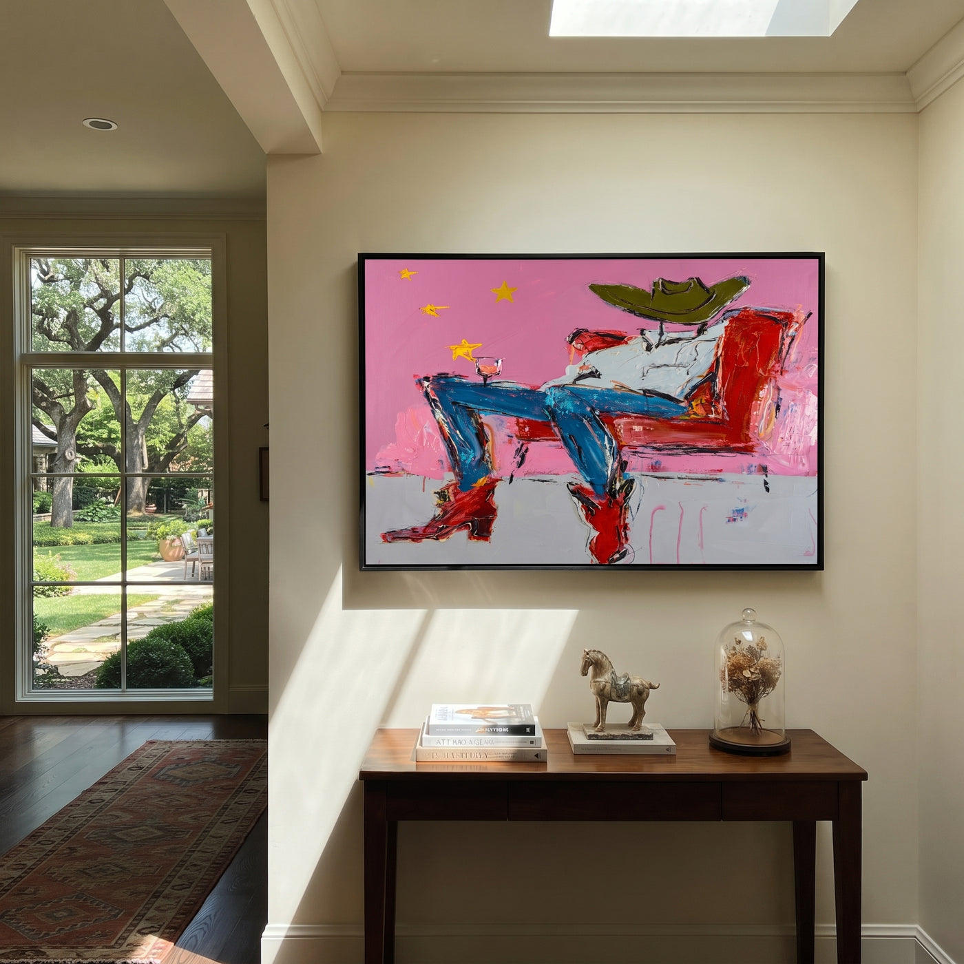 Red Chair Drifts Pink - reclining cowboy chair painting by Ethan Mercer, contemporary Western horizontal wall art – styled room scene view 1