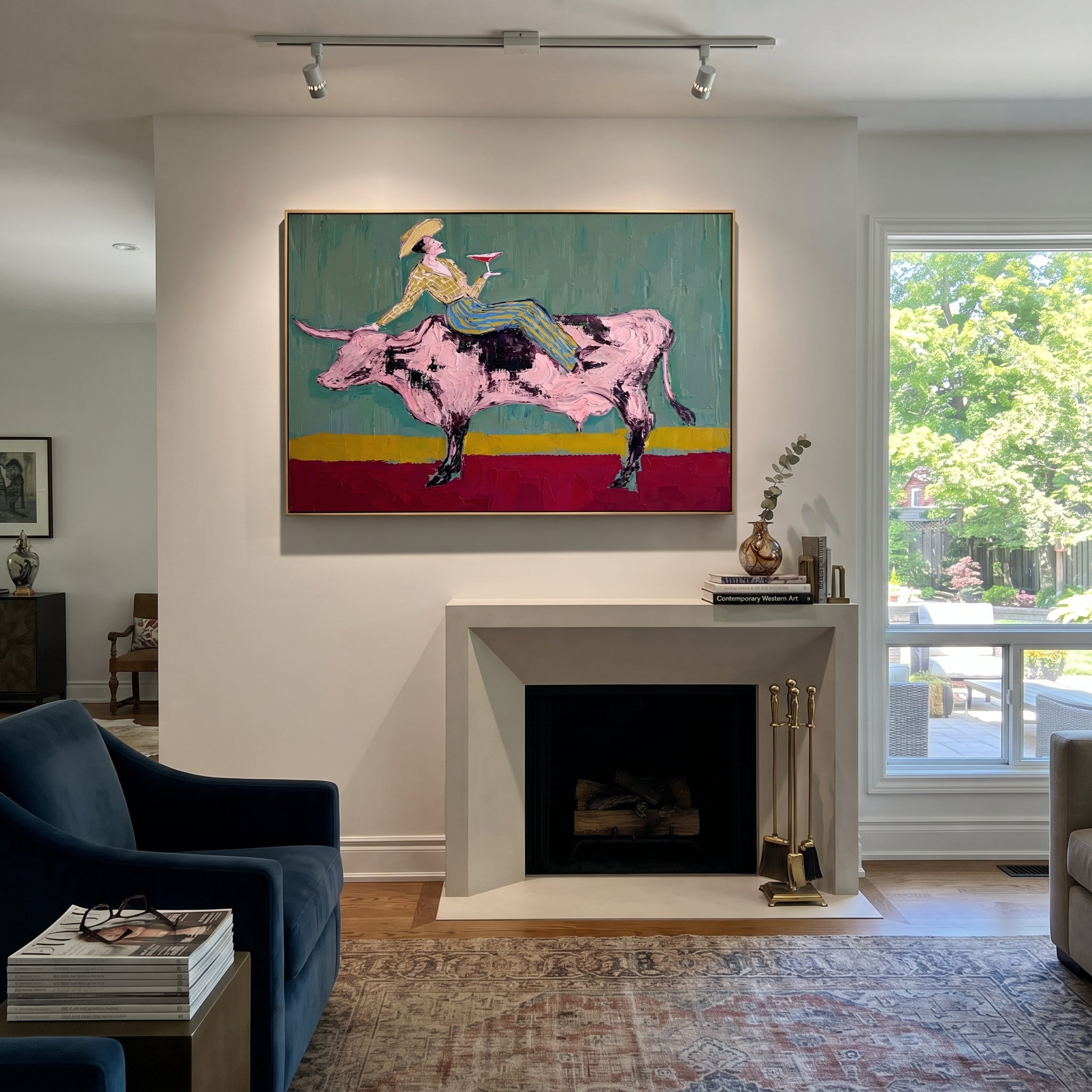 Pink Bull Crosses Teal - cowgirl bull wine painting by Ethan Mercer, contemporary Western horizontal wall art – styled room scene view 4