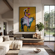 Golden Toast Rides Silver - cowgirl silver bull painting by Ethan Mercer, contemporary Western vertical wall art – styled room scene view 1