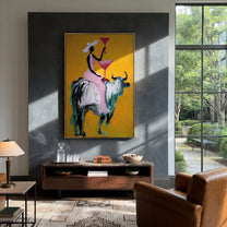 Golden Toast Rides Silver - cowgirl silver bull painting by Ethan Mercer, contemporary Western vertical wall art – styled room scene view 4