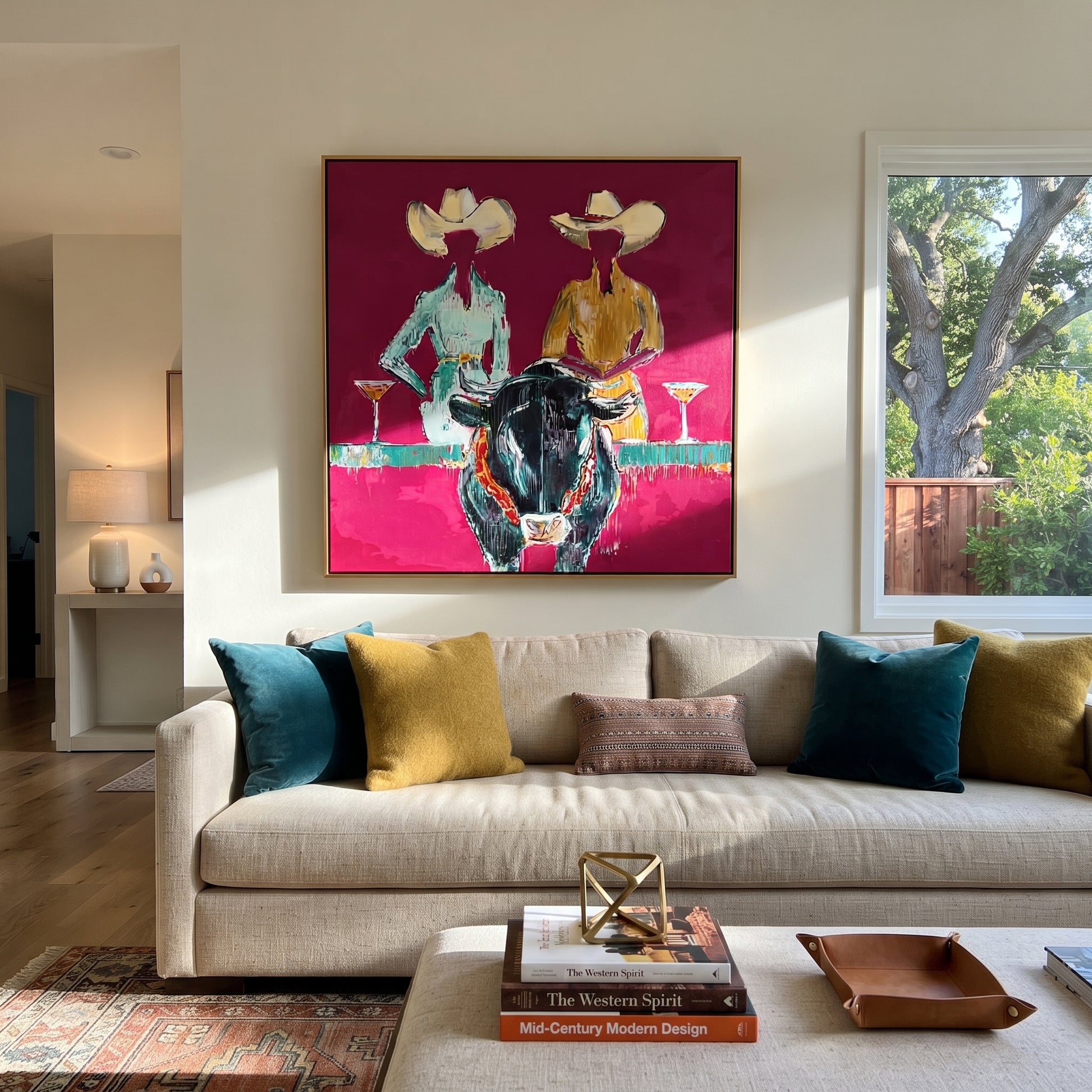 Two Hats Toast Midnight - cowgirl bull cocktail painting by Ethan Mercer, contemporary Western square wall art – styled room scene view 1