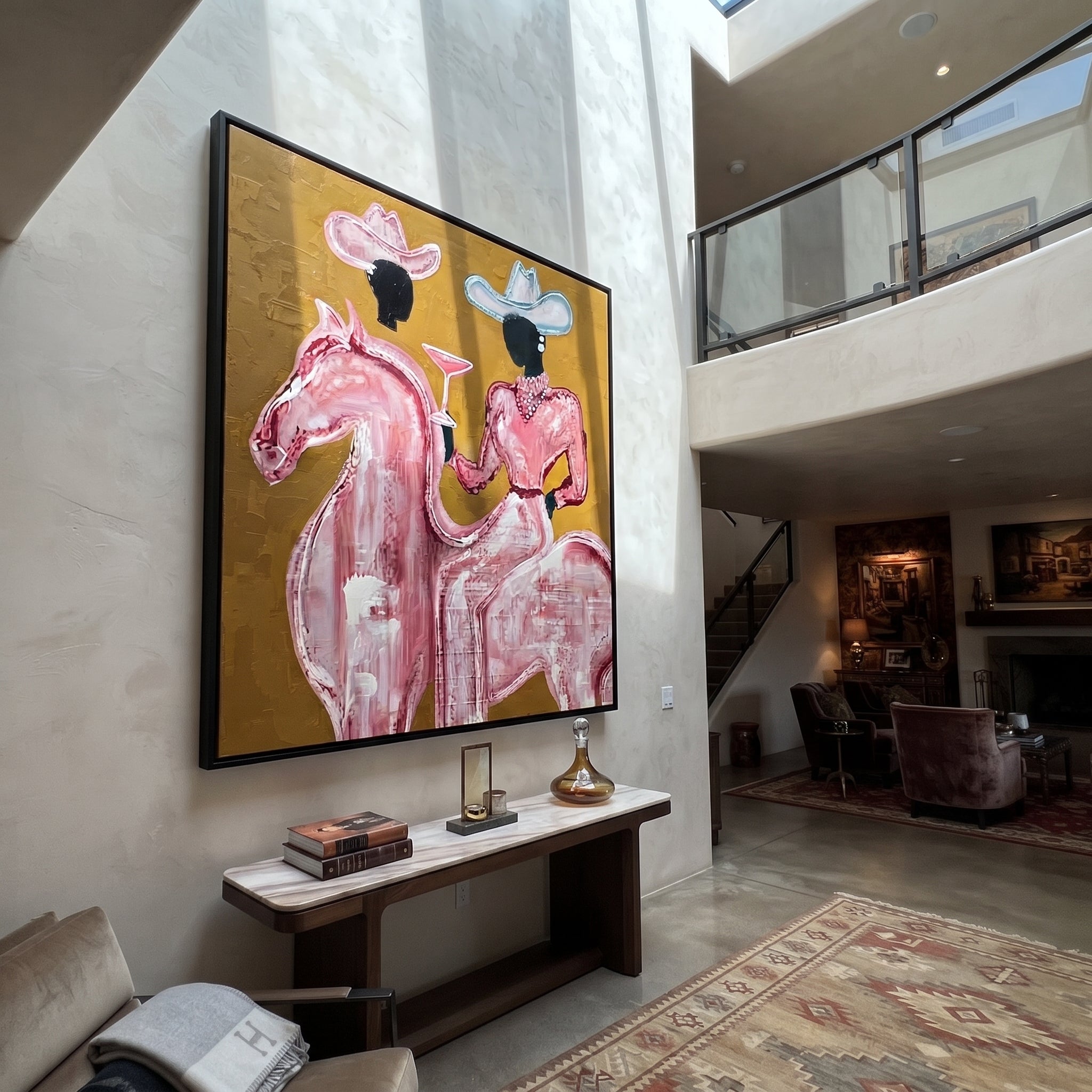 Pink Rider Raises Glass - pink horse cowgirl painting by Ethan Mercer, contemporary Western square wall art – styled room scene view 3