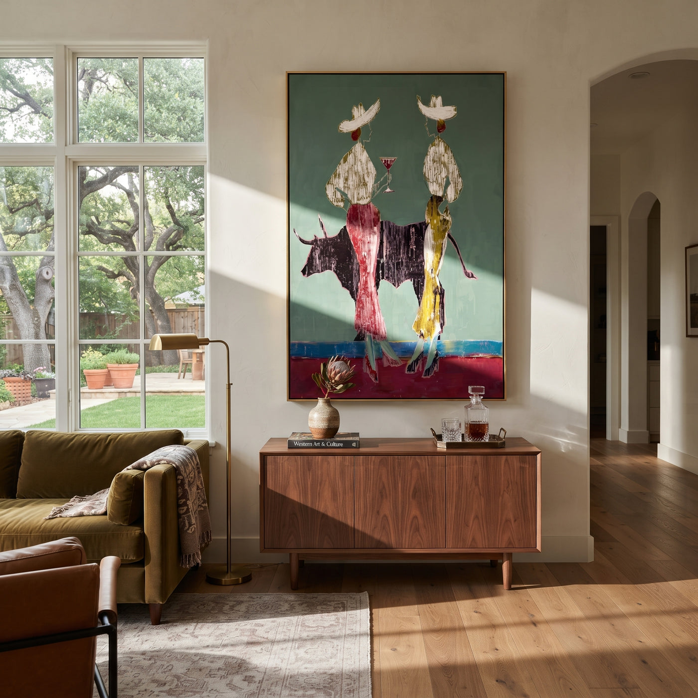 Bull Divides White Hats - bull cowgirl pair painting by Ethan Mercer, contemporary Western vertical wall art – styled room scene view 1