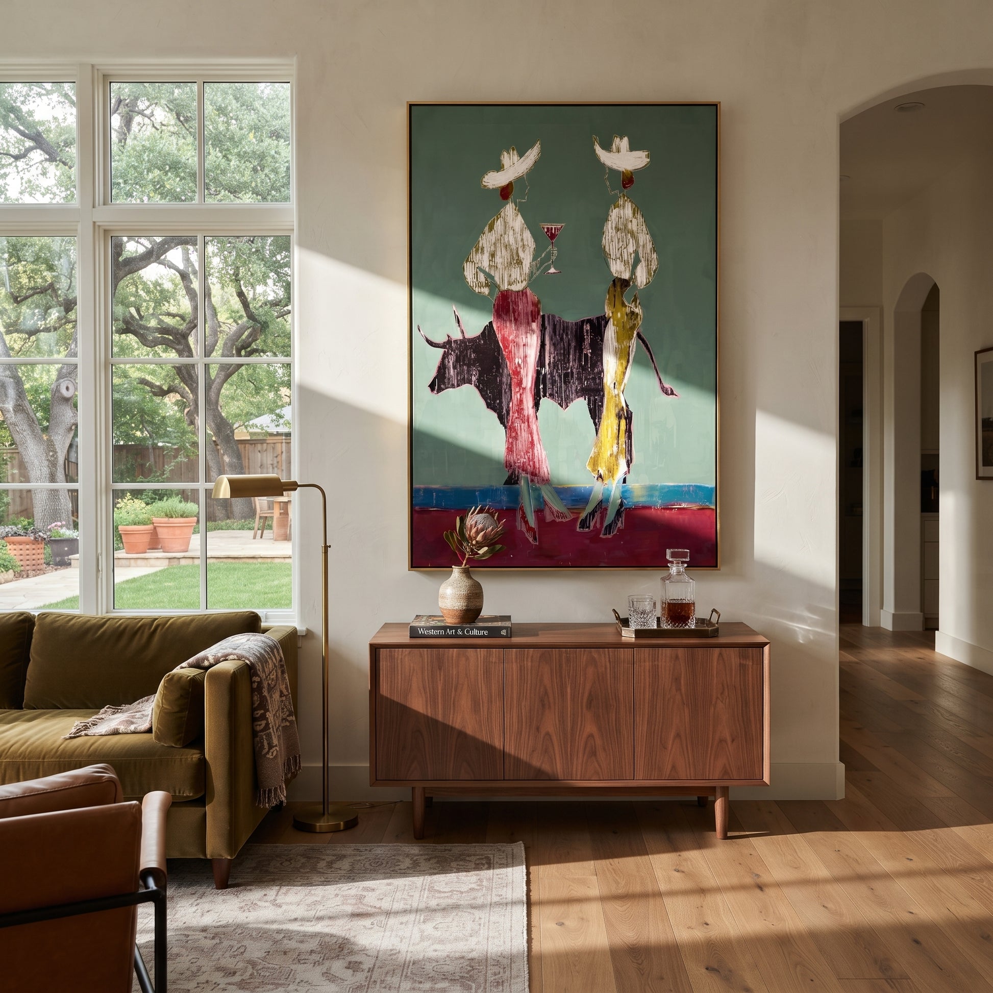 Bull Divides White Hats - bull cowgirl pair painting by Ethan Mercer, contemporary Western vertical wall art – styled room scene view 1