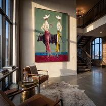 Bull Divides White Hats - bull cowgirl pair painting by Ethan Mercer, contemporary Western vertical wall art – styled room scene view 4
