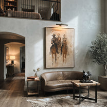 Three Riders Fade Sepia - sepia horse riders painting by Ethan Mercer, contemporary Western vertical wall art – styled room scene view 5